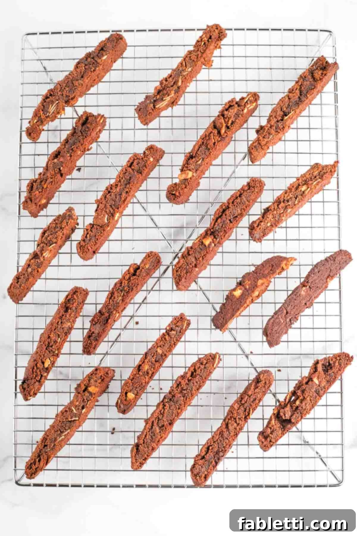 Irresistible Vegan Gluten-Free Chocolate Almond Biscotti 15 Cooling rack with freshly baked chocolate almond biscotti.