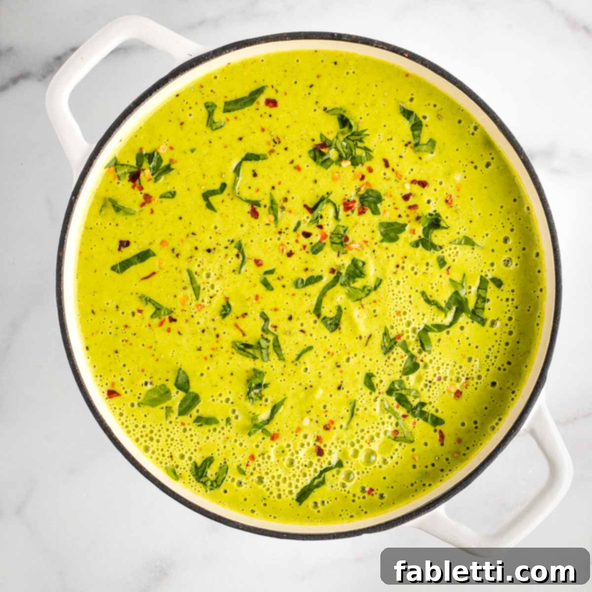 Sheet Pan Green Velvet Soup 12 Pureed vegetable soup sprinkled with fresh herbs and crushed red pepper.