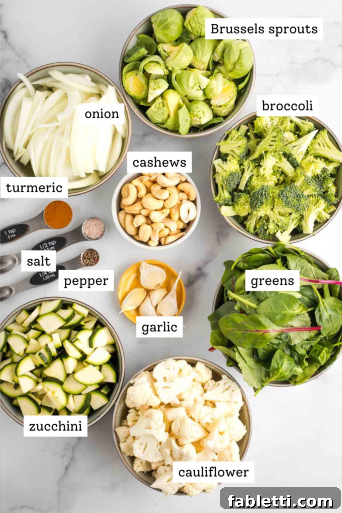 Sheet Pan Green Velvet Soup 3 Labeled ingredient shot for green blender soup: chopped veggies, spices, cashews, garlic and greens.