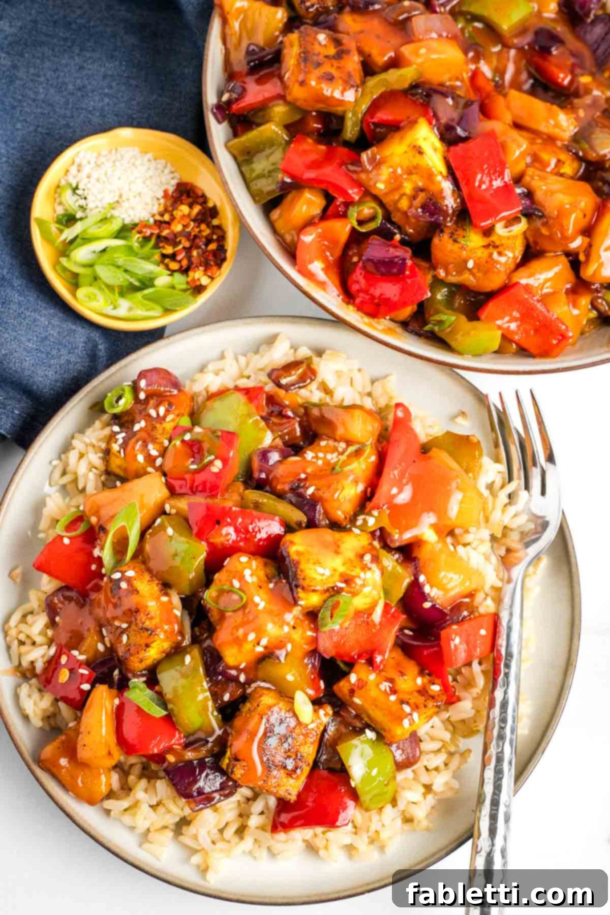 Crispy tofu plus bell peppers, onions and pineapple with a sweet and sour sauce, served over rice.