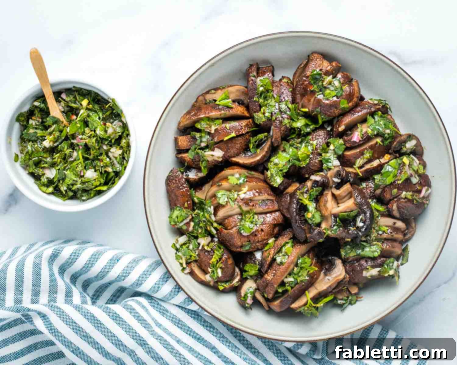 Zesty Chimichurri Portobello Steaks 15 Portobello mushrooms, roasted and sliced, covered in vibrant green chimichurri.
