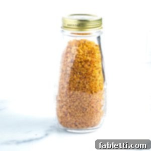 Bottle filled with golden, crispy quinoa, highlighting its appetizing crunch.