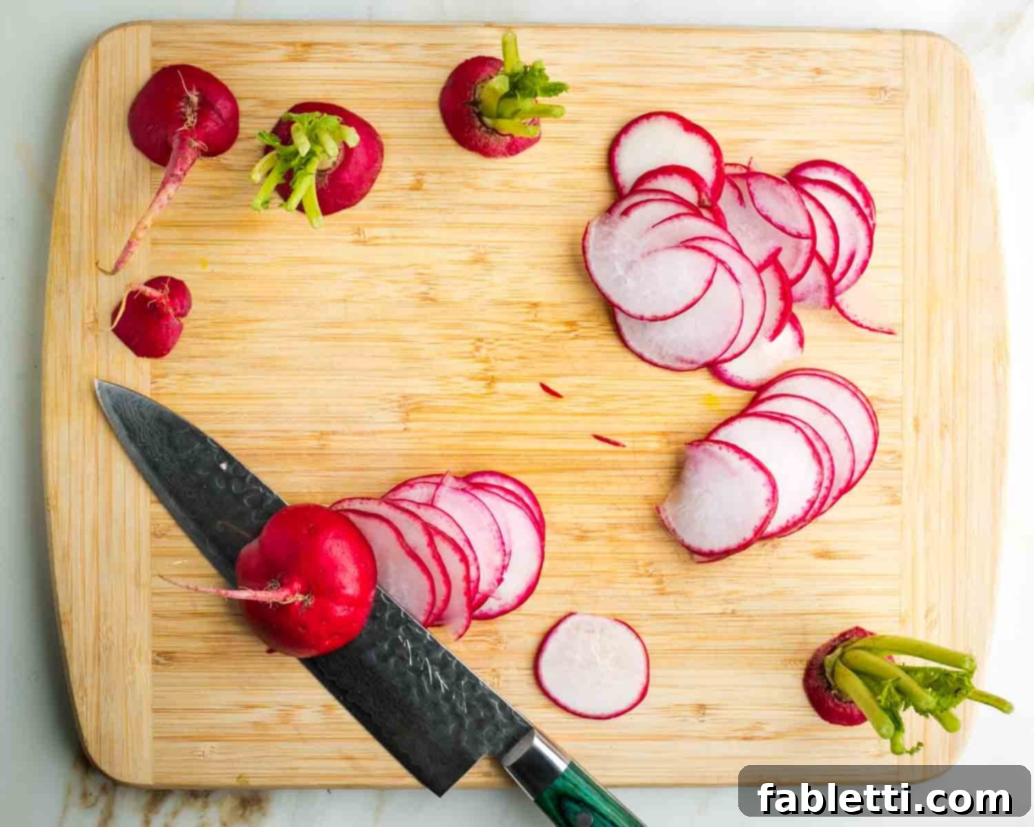 Fresh Spring Roll Salad Bowl with Creamy Peanut Sauce 11 Knife making thin slices of radish.