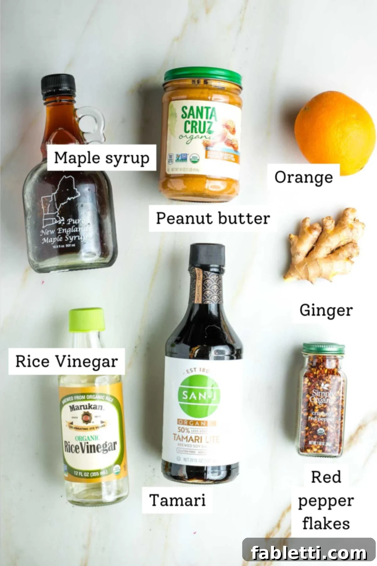 Fresh Spring Roll Salad Bowl with Creamy Peanut Sauce 4 Labeled ingredients: maple syrup, peanut butter, orange, rice vinegar, tamari, crushed red pepper flakes.