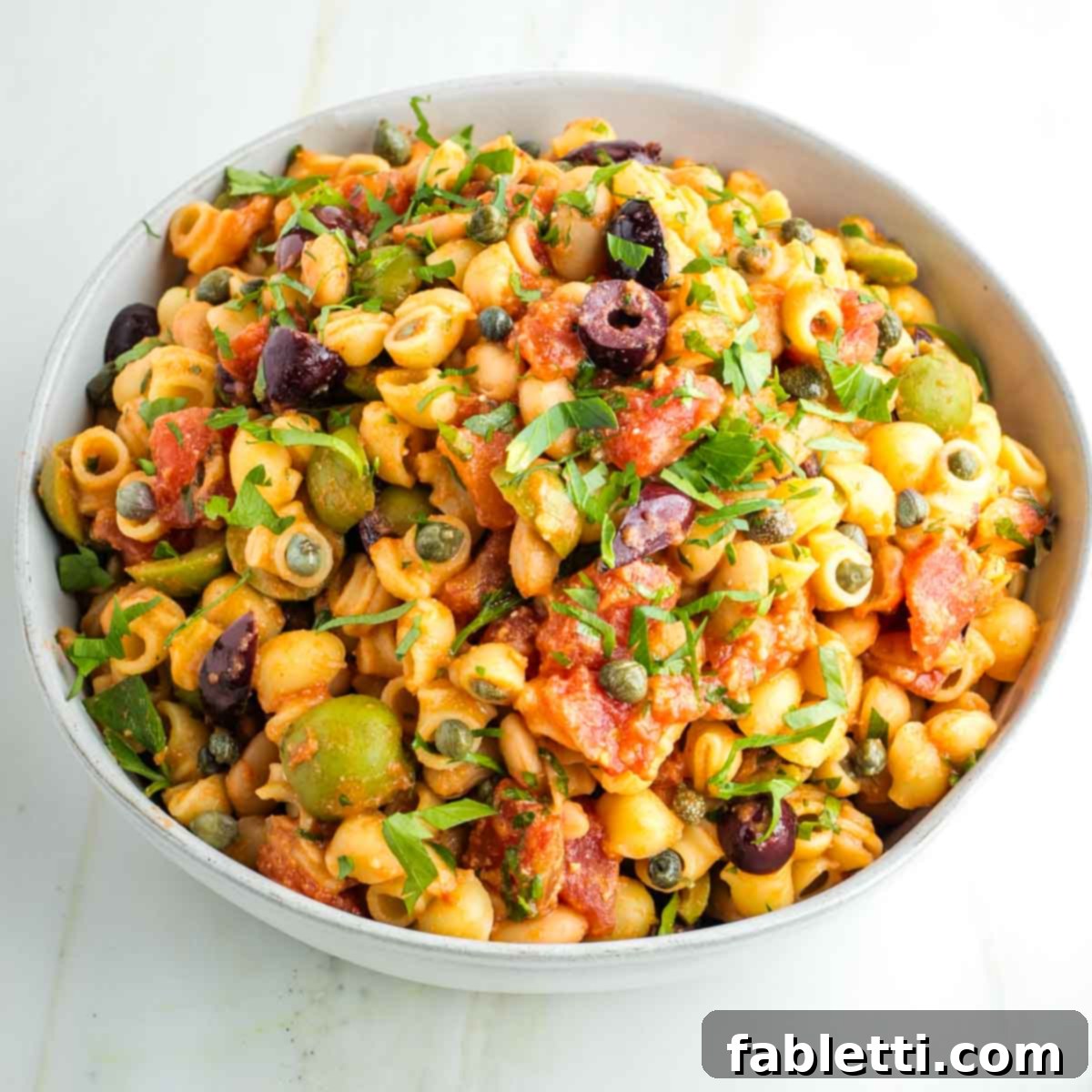 Zesty White Bean Puttanesca Pasta 11 A generous serving of White Bean Vegan Pasta Puttanesca ready to be savored.