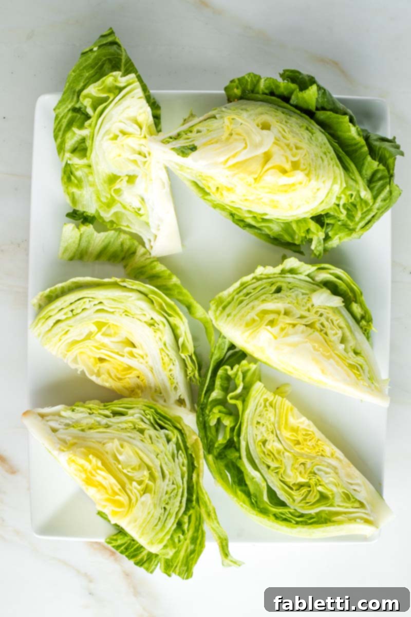 Smoky Shiitake and Zesty Russian Vegan Wedge 14 Six crisp wedges of iceberg lettuce arranged neatly on a serving platter, ready for toppings.