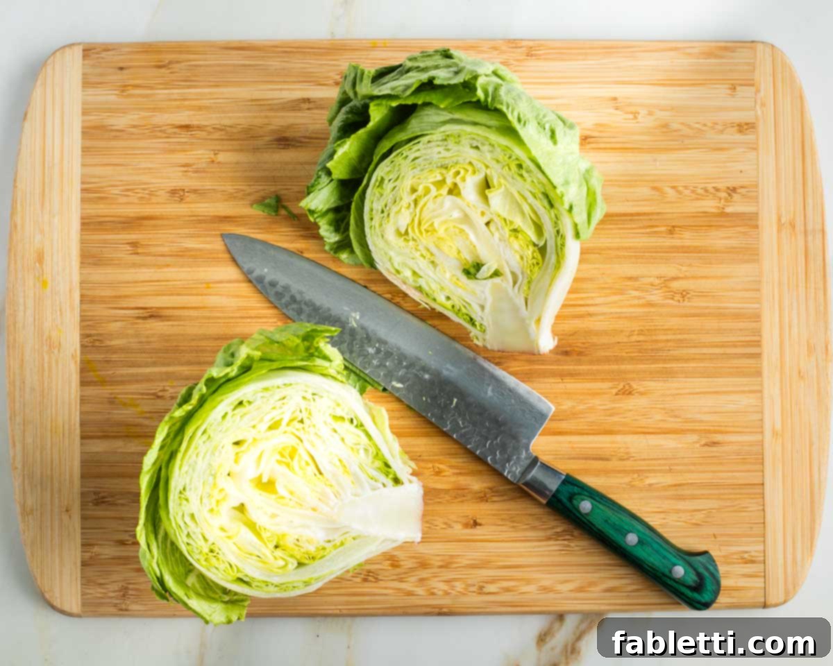 Smoky Shiitake and Zesty Russian Vegan Wedge 4 Head of iceberg lettuce cut in half through the core, showing the clean interior.