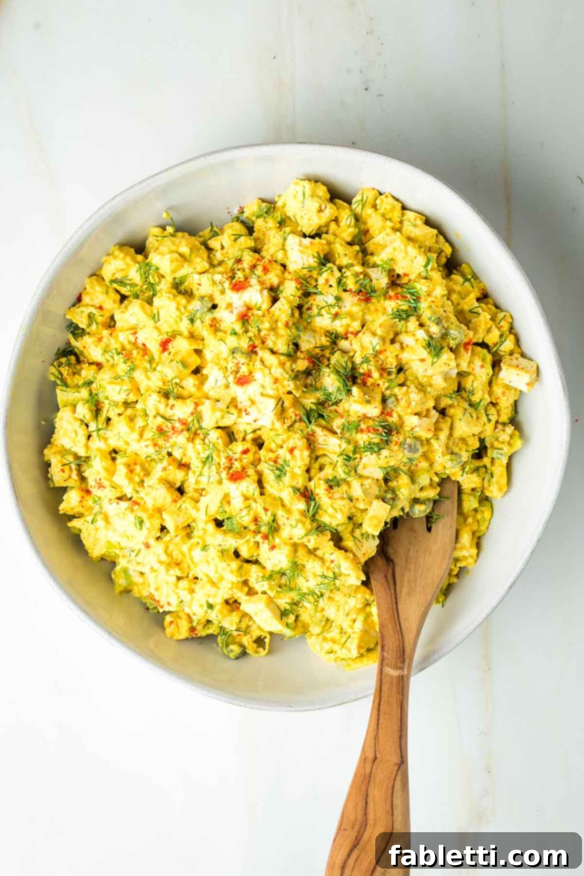 Zingy Vegan Tofu Egg Salad 18 Chunky tofu egg salad with celery, fresh dill and sprinkled on top with paprika.