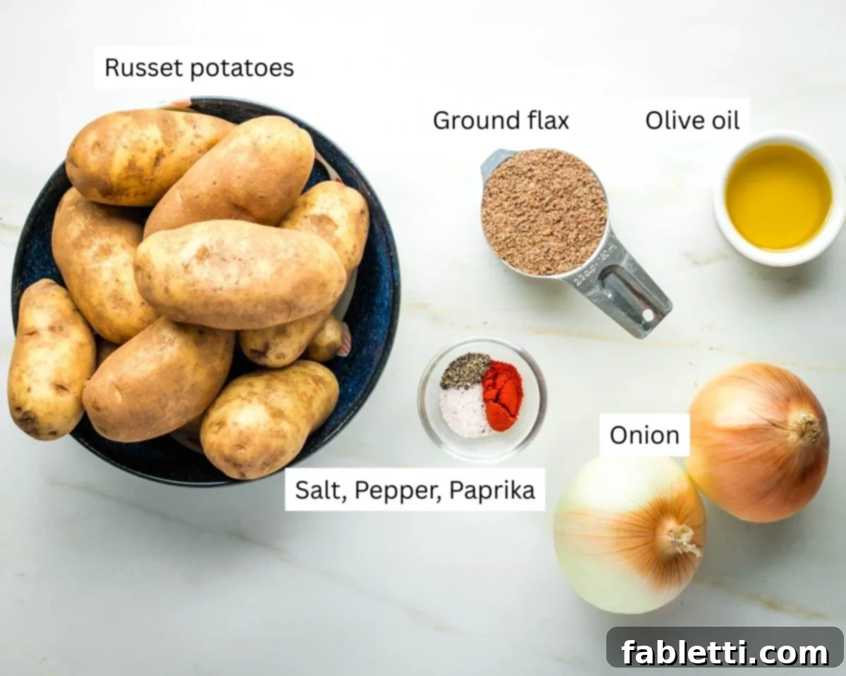 Ultimate Vegan Potato Kugel 3 Labeled ingredients for potato kugel: whole and shredded potatoes, various spices, a whole onion, olive oil, and ground flax.