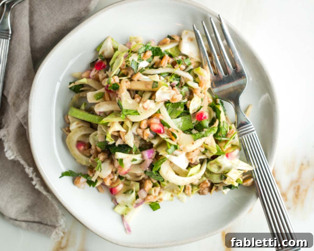 Vibrant Apple Fennel Farro Salad with Pomegranate Gems 15 A beautifully arranged serving suggestion for the apple and fennel salad, showcasing its vibrant colors and fresh ingredients, perfect for inspiring home cooks.