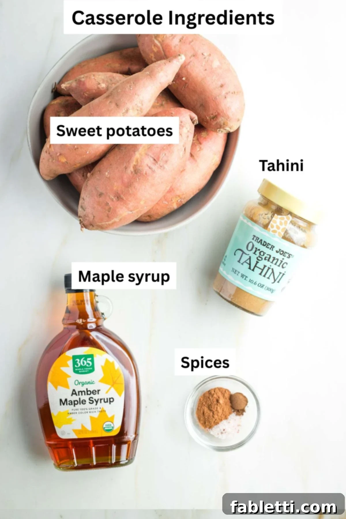Golden Maple Pecan Sweet Potato Casserole 3 Labeled sweet potato casserole ingredients: whole sweet potatoes in a bowl, tahini, maple syrup and spices ready for preparation.