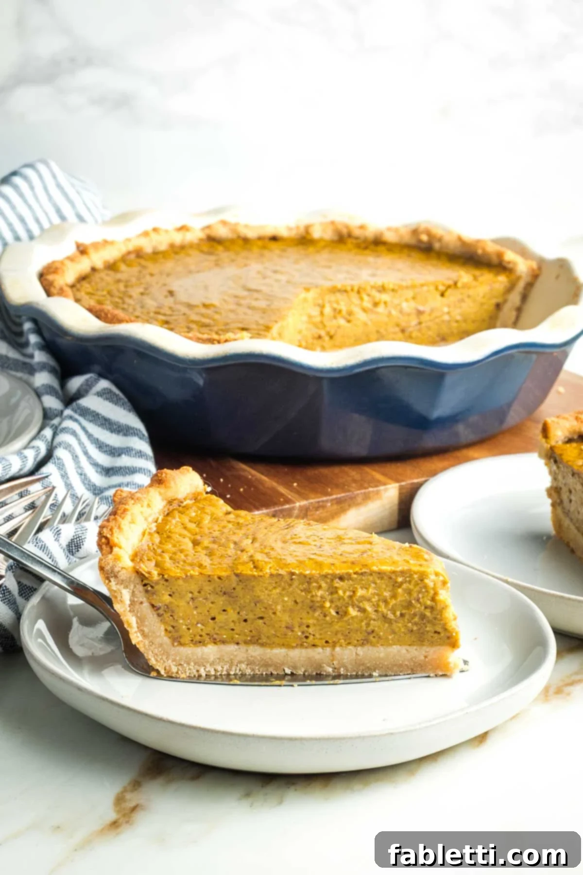 Effortless Vegan Pumpkin Pie with a Homemade Dairy-Free Crust 18 A whole vegan pumpkin pie, illustrating its appealing texture and rich color, ready to be enjoyed.