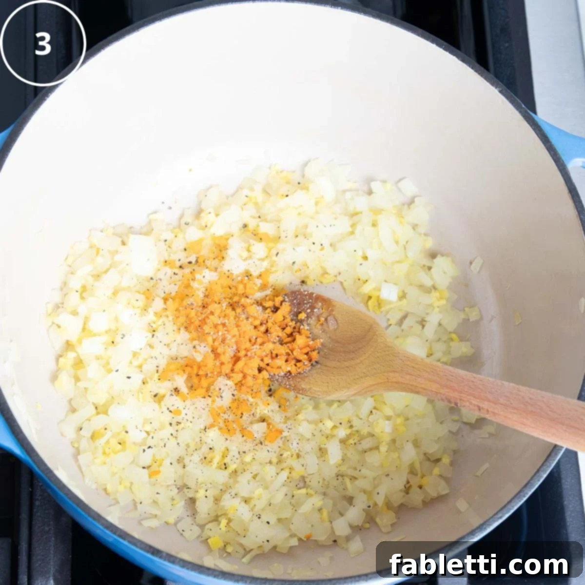Golden Vegan Carrot Ginger Soup 10 Sautéed onions and ginger are now topped with freshly minced turmeric in the Dutch oven, adding a golden hue.