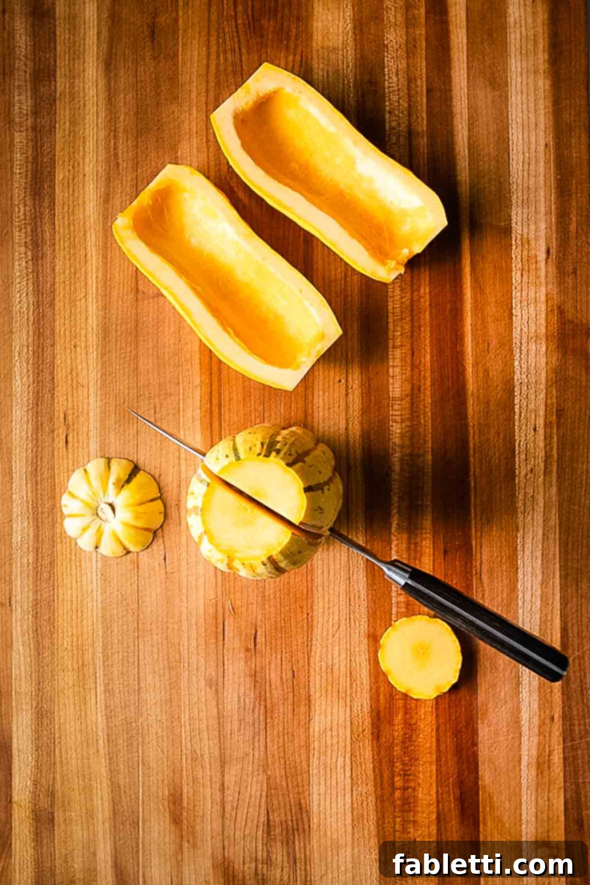 Golden Roasted Delicata Squash 5 Scooped out delicata squash halves ready for slicing.