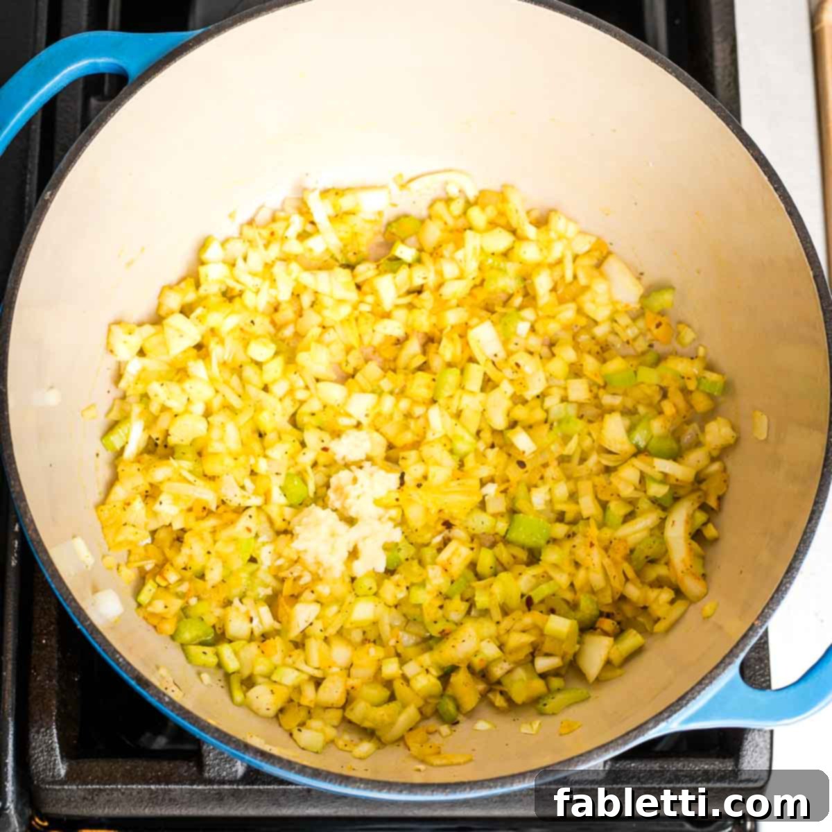 Creamy Vegan Tomato Soup 6 Sauteed onions, celery, and spices with freshly minced garlic added.