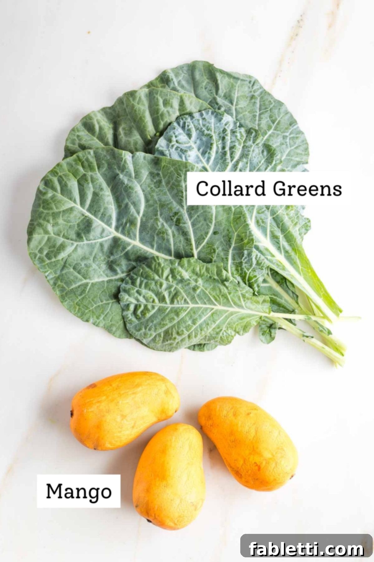 Fresh mango and collard greens, prepared for blending.
