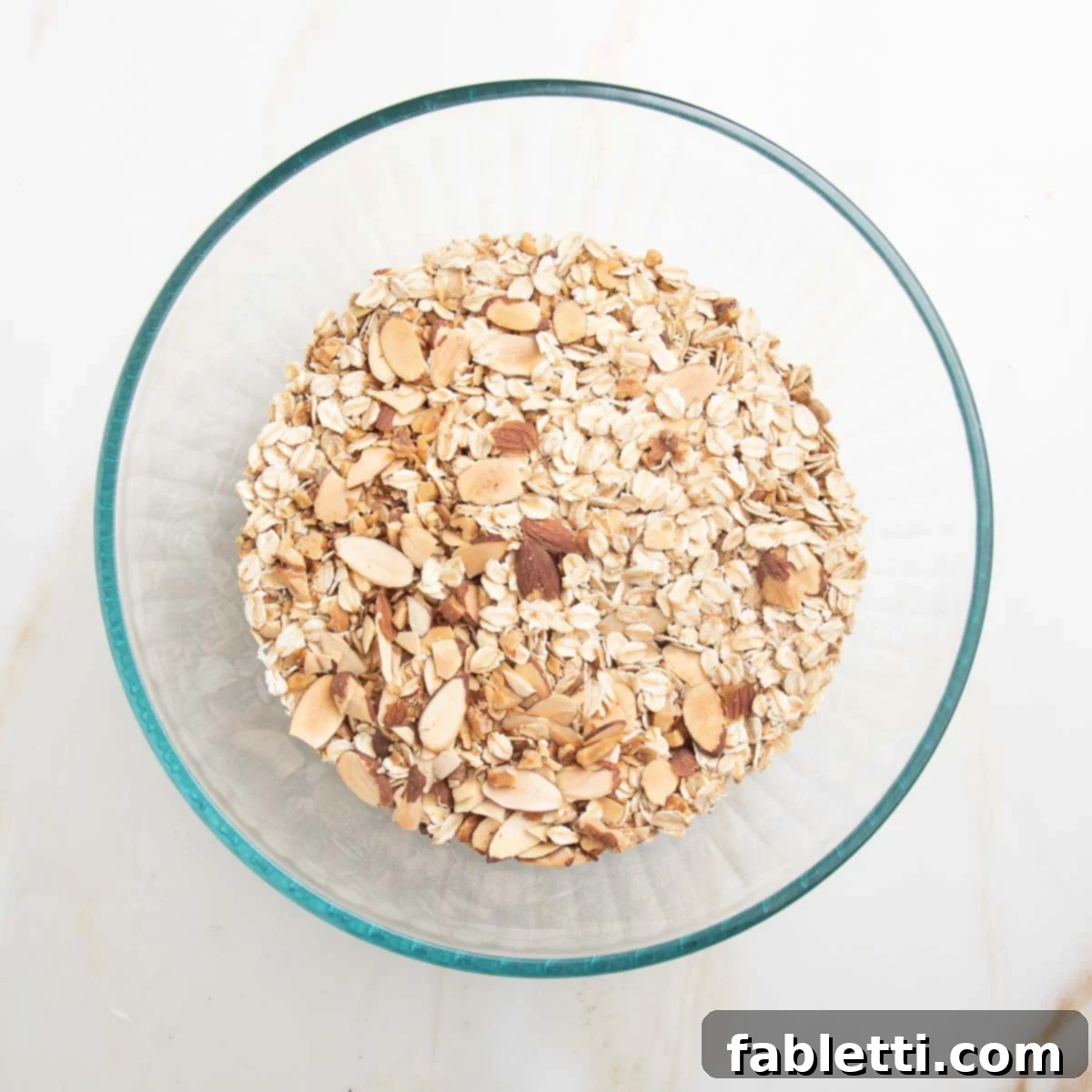 Golden Baked Granola Bites 7 Bowl with assorted toasted oats, nuts and seeds, now cooled.