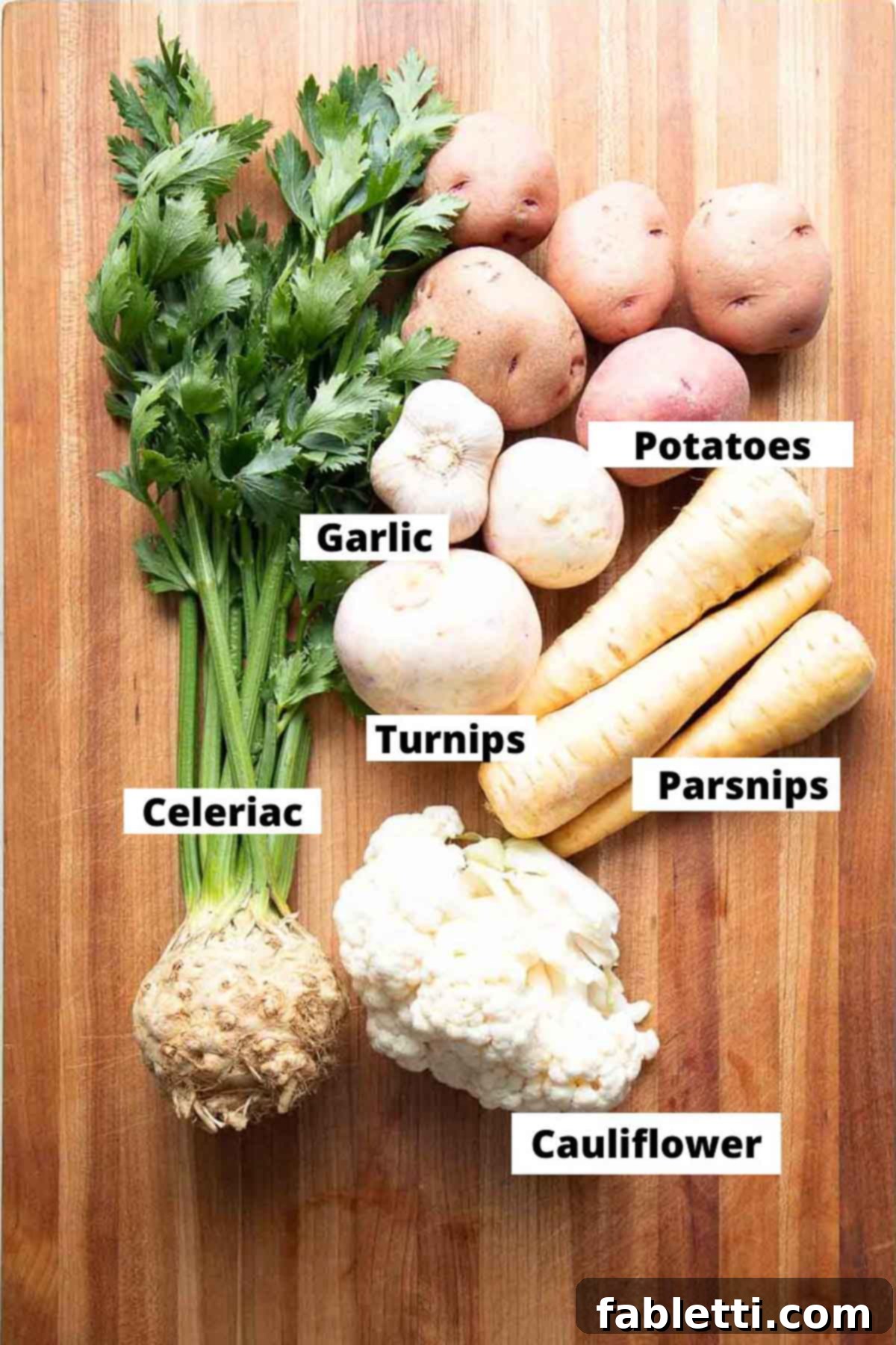 Heavenly Dairy-Free Garlic Mash 3 Labeled ingredients for a healthy and flavorful batch of dairy-free garlic mashed potatoes, showcasing a variety of root vegetables.