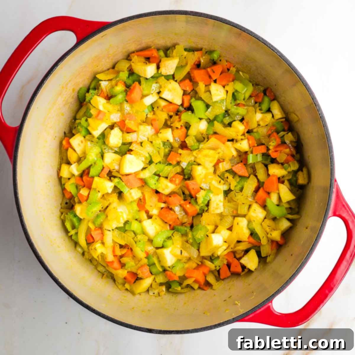 Velvety Plant-Based Broccoli Soup 9 Dutch oven with sauteed diced vegetables.