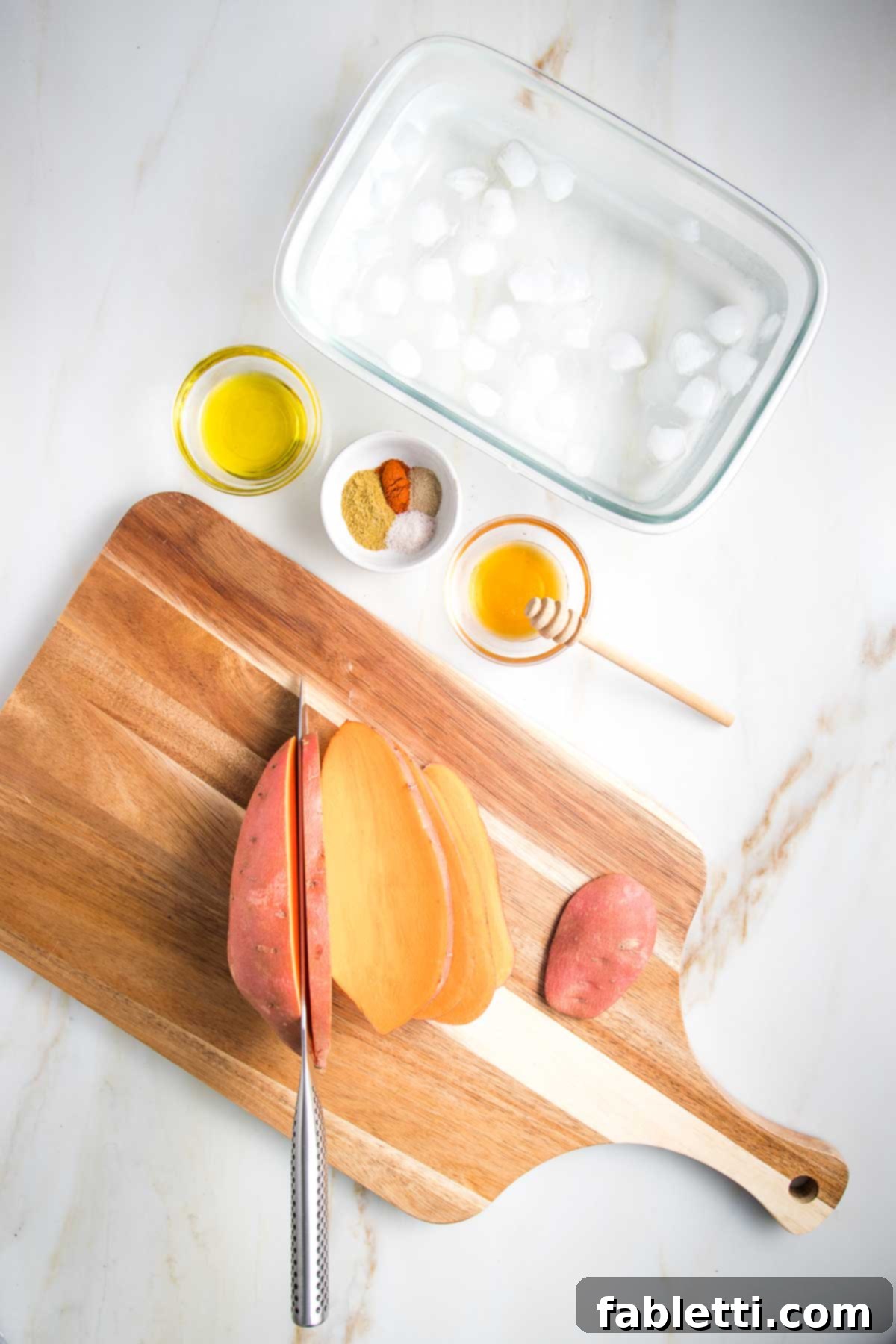 Golden Crispy Sweet Potato Fries 4 Sweet potato being sliced into ¼
