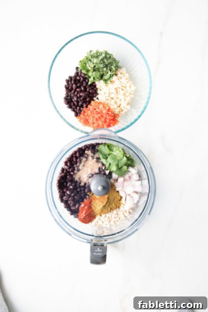 Plant-Powered Black Bean Burgers 5 One bowl containing chopped red peppers, whole black beans, fresh cilantro, and cooked rice for burger texture. Beside it, a food processor bowl filled with remaining beans, spices, shallots, and oats for the binding paste.