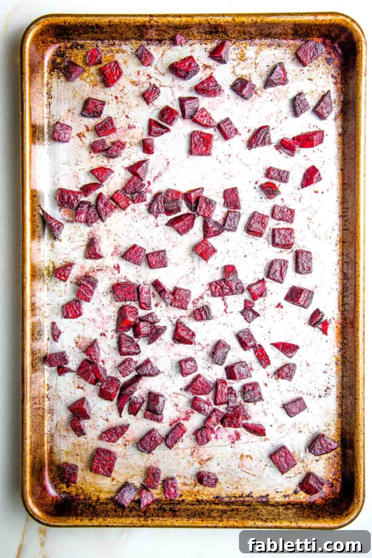 Vibrant Butternut Beetroot Medley 12 Roasted diced beetroot on a large baking tray.