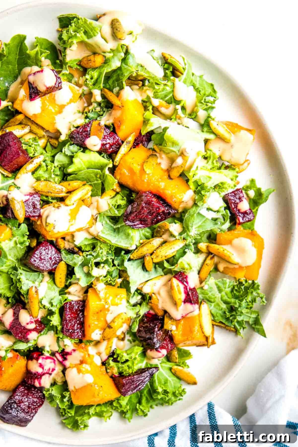 Vibrant Butternut Beetroot Medley 15 Roasted Squash cubes, diced beets and pumpkin seeds over massaged kale with a creamy dressing.