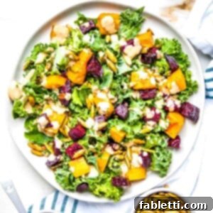 Vibrant Butternut Beetroot Medley 16 Kale salad with roasted squash and beets. Toasted pumpkin seeds and a creamy dressing complete the salad.