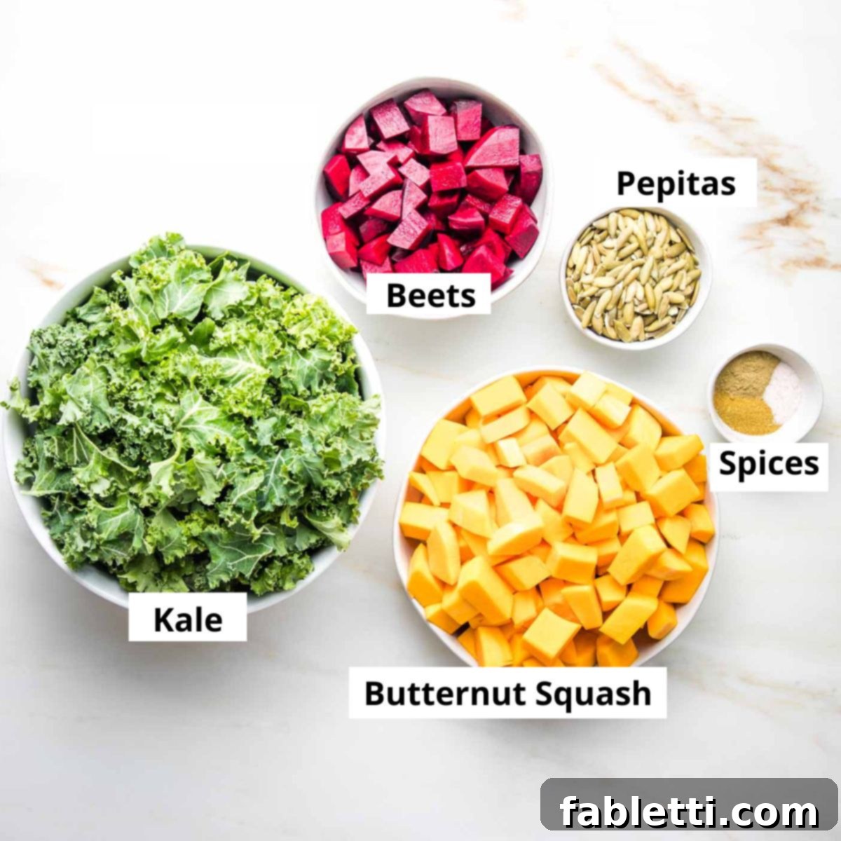 Vibrant Butternut Beetroot Medley 4 Labeled ingredients: kale, butternut squash, beets, pepitas, spices.