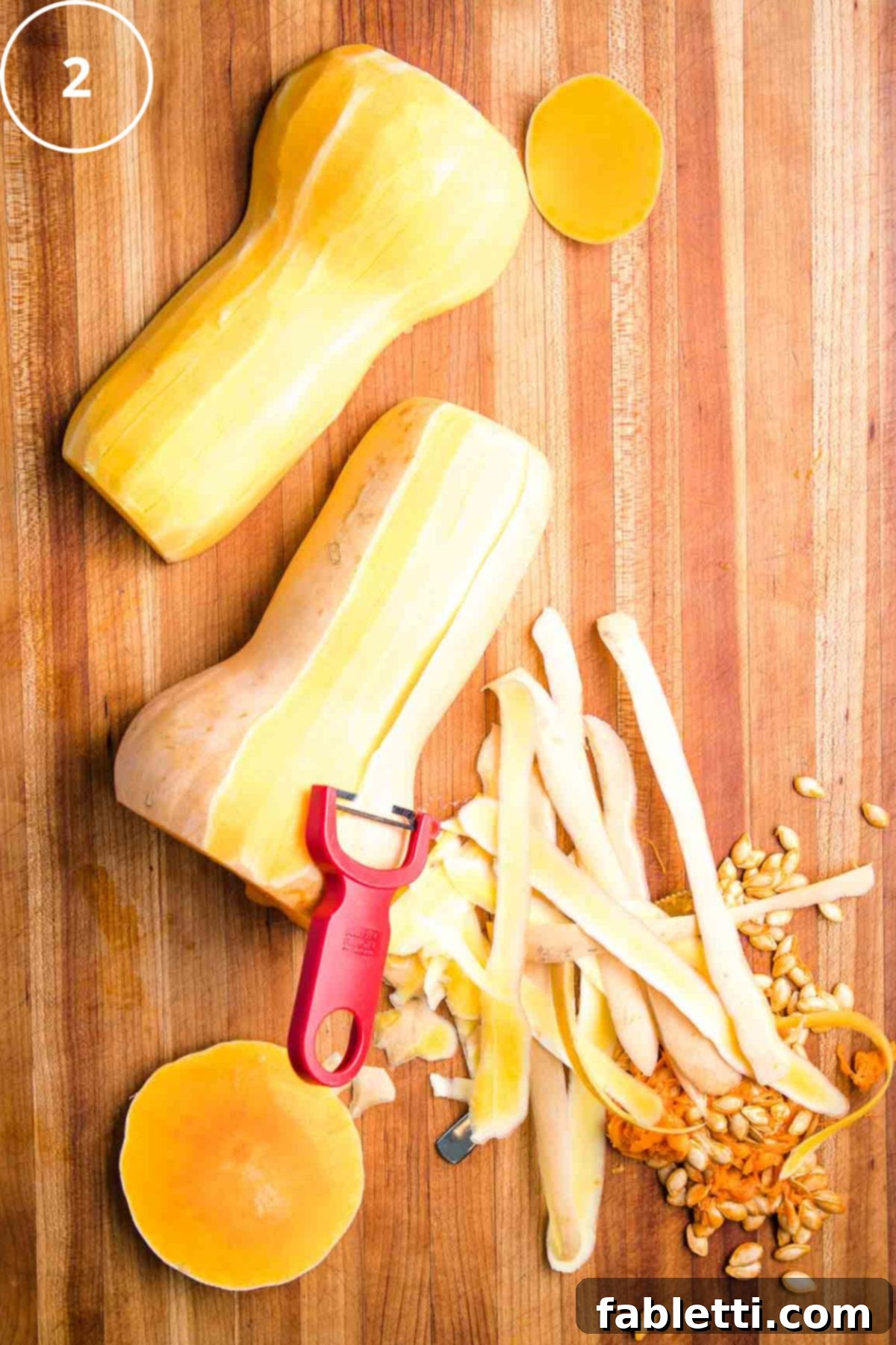 Vibrant Butternut Beetroot Medley 6 A "y" vegetable peeler, peeling butternut squash halves.