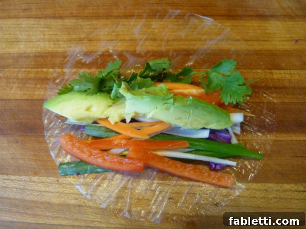 A close-up of beautifully prepared veggie spring rolls, highlighting their fresh and colorful fillings.