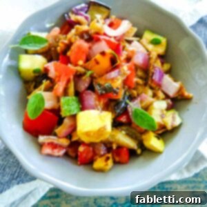 Smoky Grilled Ratatouille Salad 9 Diced grilled summer vegetables with fresh oregano, ready to serve.