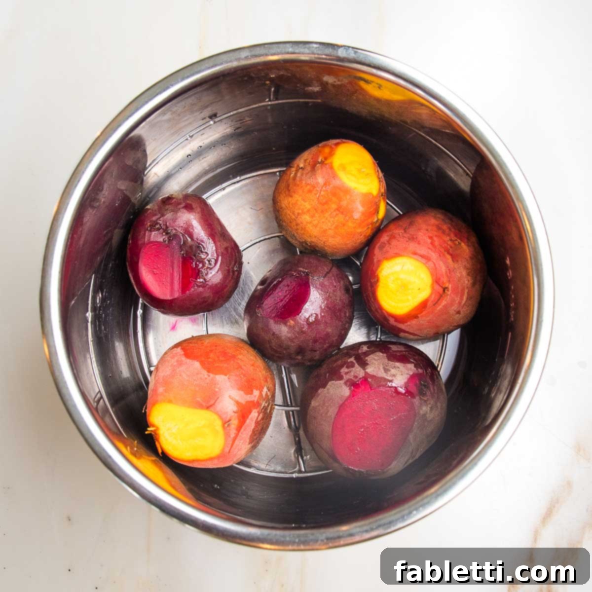 Balsamic Roasted Beet Salad 6 Whole beets, trimmed in an instant pot bowl on a rack with 1" of water.