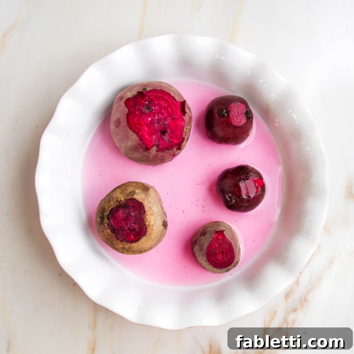 Balsamic Roasted Beet Salad 10 Whole red beets in a pie plate with ¼" water.