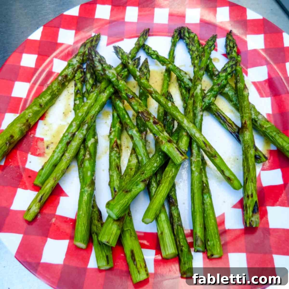 Smoked Asparagus with Dijon Glaze 7 A stunning serving platter piled high with perfectly grilled asparagus spears, beautifully and generously drizzled with the homemade zesty mustard sauce, ready to be enjoyed.