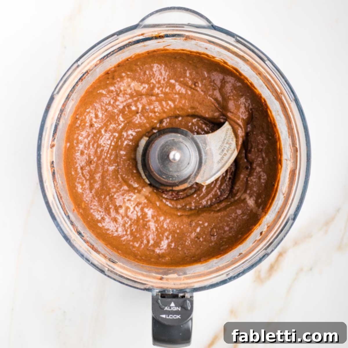 Decadent Double Chocolate Zucchini Muffins 7 Chocolate batter in the bowl of a food processor.