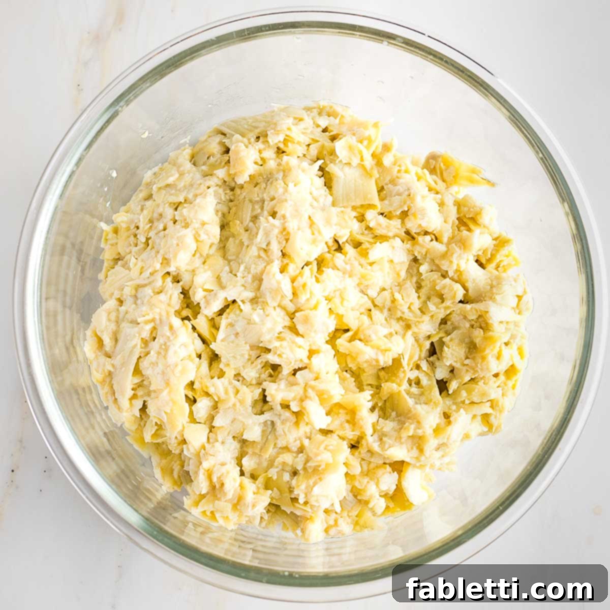 Ground artichoke hearts resembling crab meat.