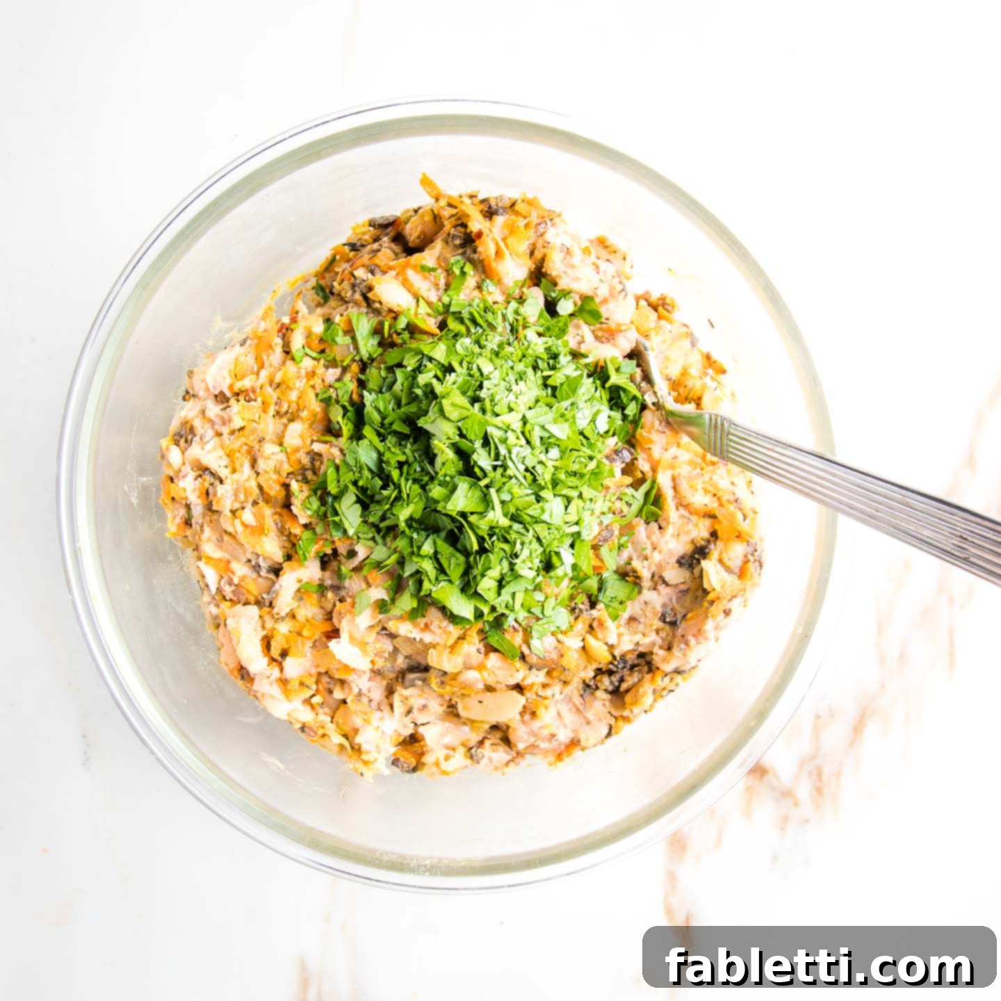 Hearty Homemade White Bean Veggie Burgers 8 The fully mixed white bean and veggie batter, topped with a vibrant sprinkle of finely chopped fresh parsley.