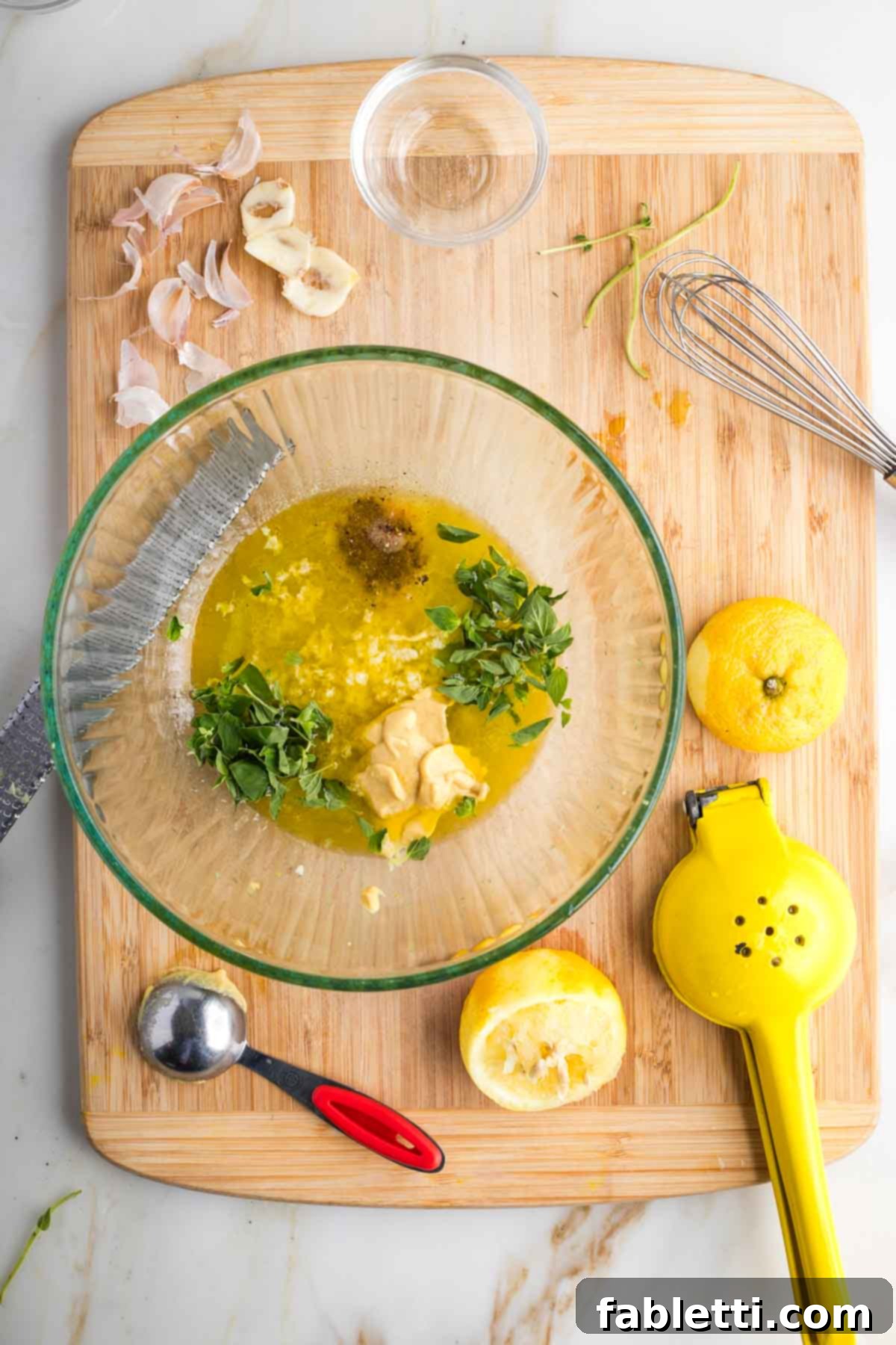 Vibrant Mediterranean Veggie Skewers 5 Large bowl with fresh lemon juice, olive oil, minced garlic, fresh oregano, salt, and pepper, forming a vibrant Mediterranean marinade.