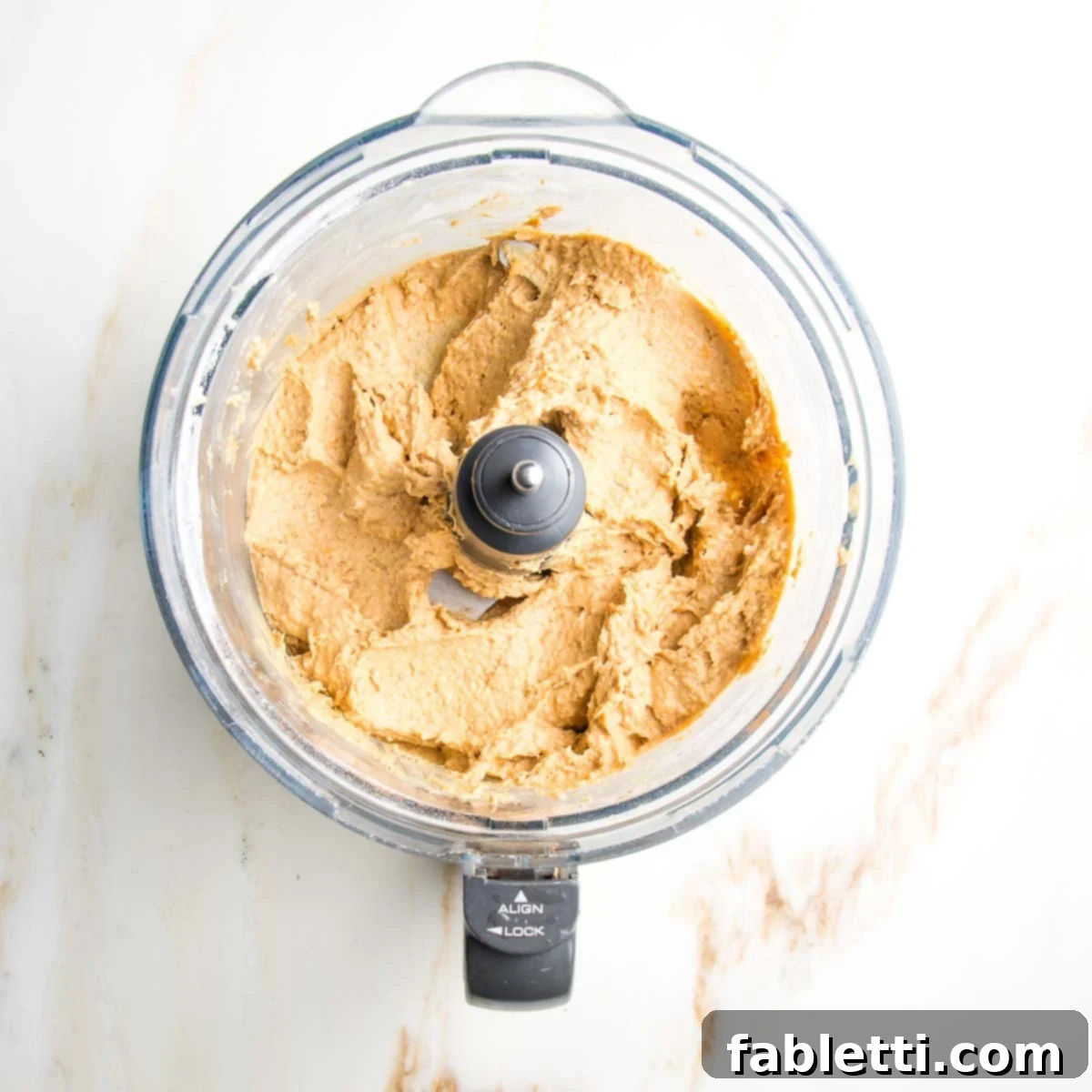 Decadent Vegan Gluten-Free Chocolate Chunk Skillet Cookie 6 Smooth, creamy cookie dough batter perfectly blended in the bowl of a food processor.