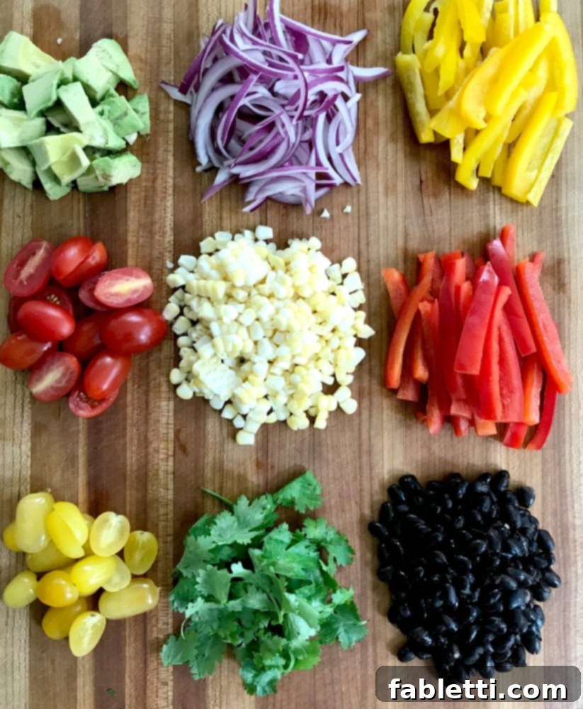 Oven-Crisped Taco Salad 3 Colorful chopped veggies: avocado, tomatoes, onions, bell peppers, cilantro, corn, black beans