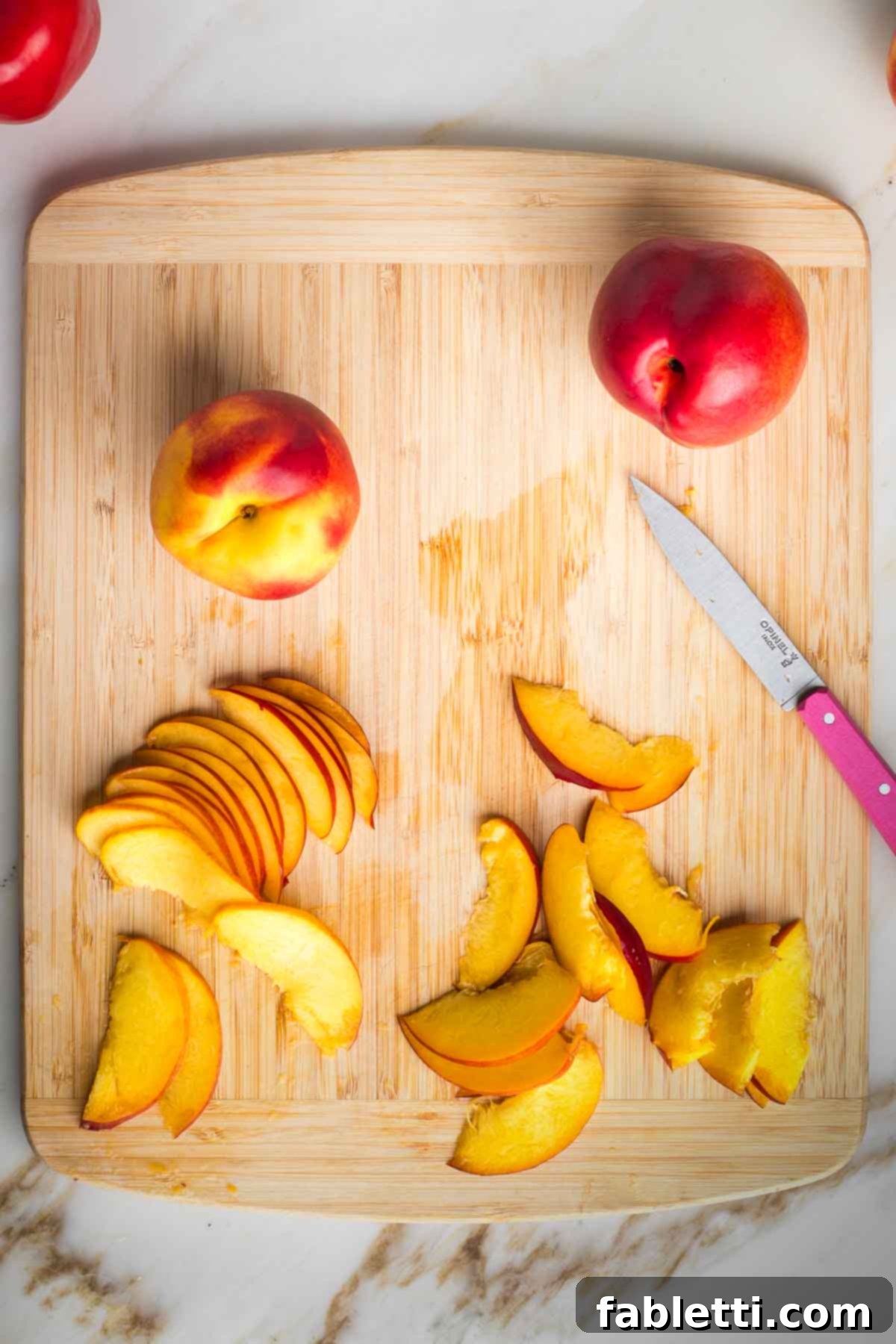 Vibrant Nectarine Arugula Salad 6 Small paring knife slicing nectarine pieces from the remaining half of the fruit.