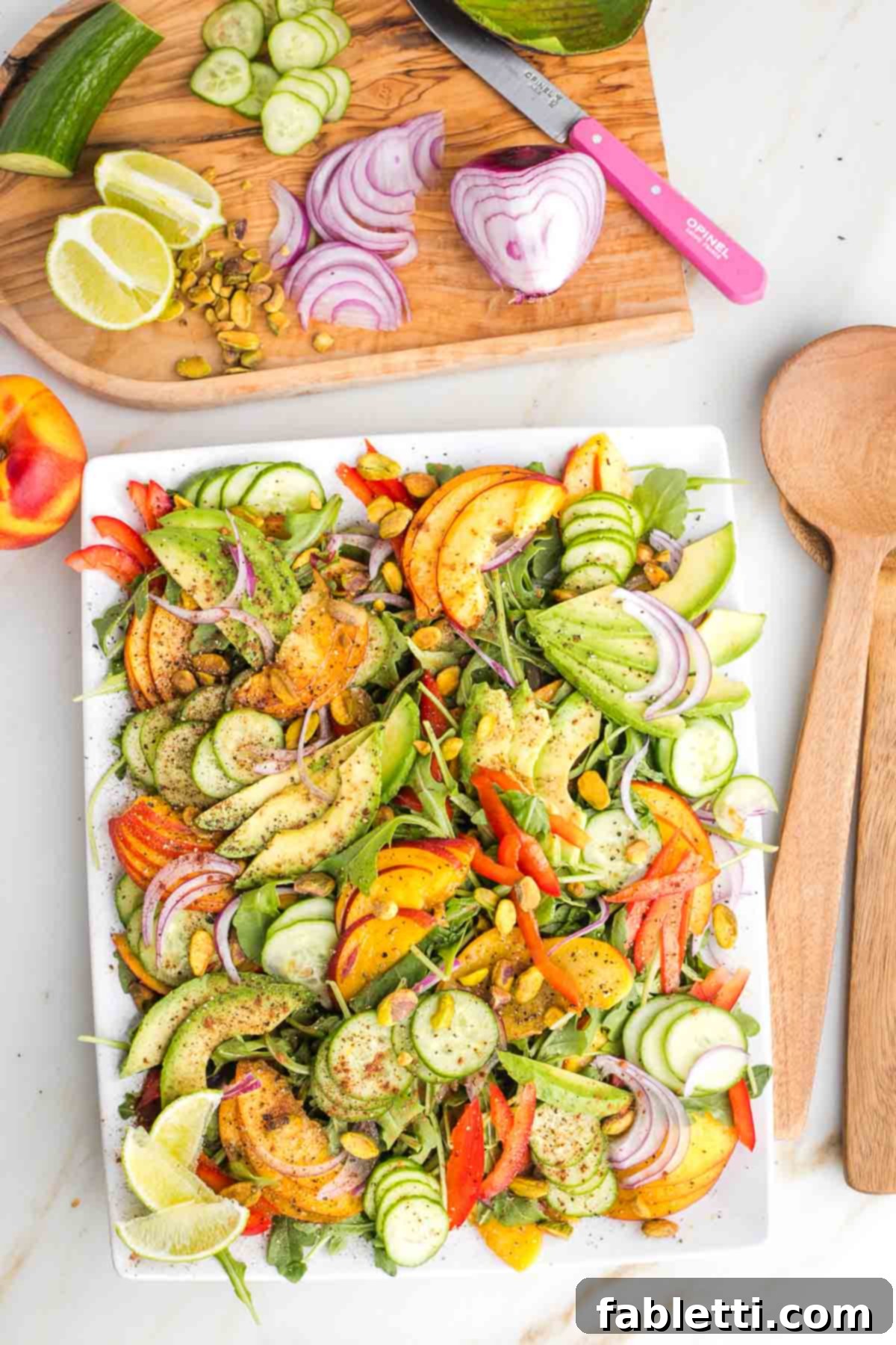 Vibrant Nectarine Arugula Salad 7 Beautifully arranged Nectarine Salad with Arugula, featuring juicy nectarines, creamy avocado, crisp cucumbers, red onions, red bell peppers, and pistachios, seasoned with lime, cinnamon, salt, and pepper. Perfect for summer gatherings.