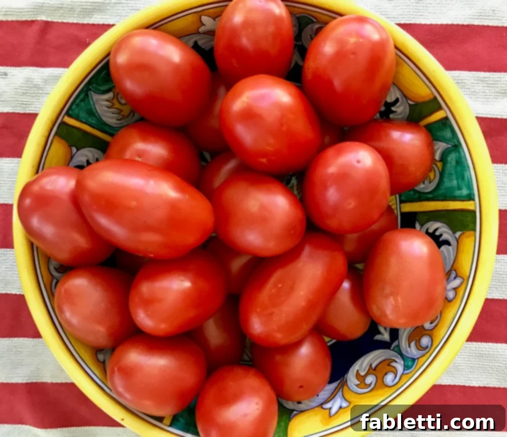 Rustic Roasted Tomato Sauce 3 Close-up of fresh, ripe tomatoes at their peak, ready for sauce making.