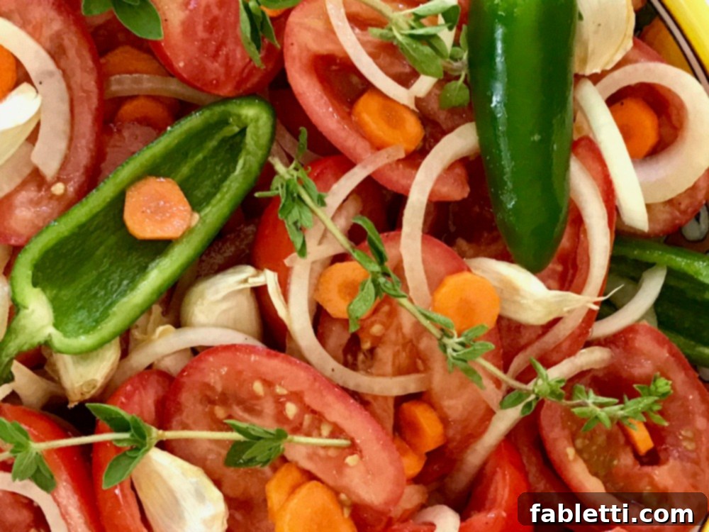 Rustic Roasted Tomato Sauce 5 An assortment of fresh ingredients like tomatoes, garlic, and onions, prepared for roasting into a delicious sauce.