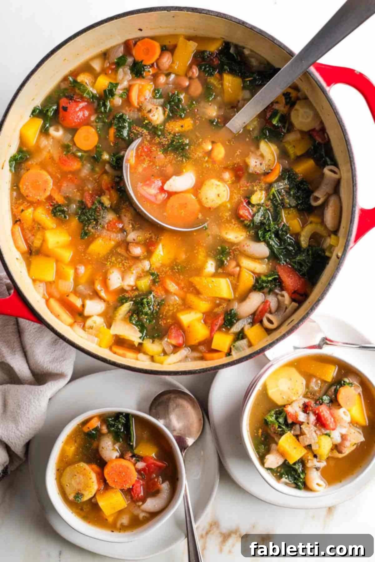 Hearty Fall Vegan Minestrone 2 Chunks of veggies, beans and pasta in a deep rich broth.