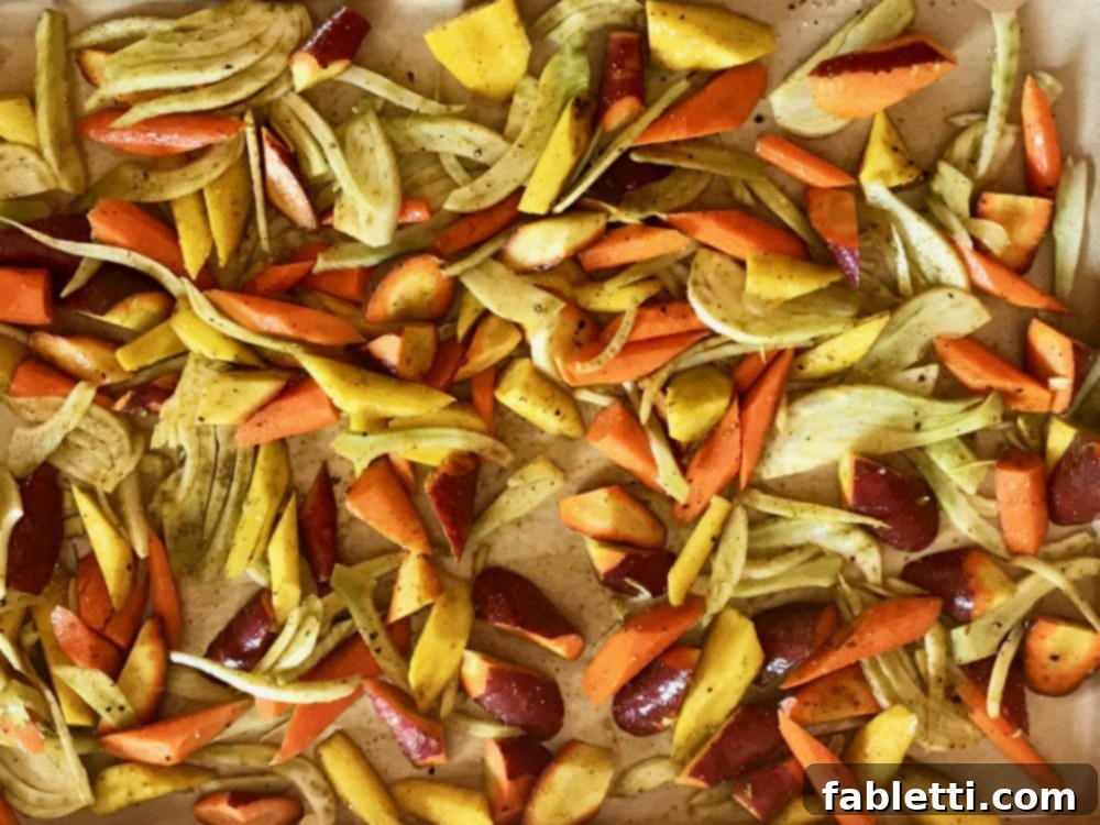 Aromatic Roasted Fennel and Carrot Salad 4 Seasoned roasted carrots and fennel on a baking sheet