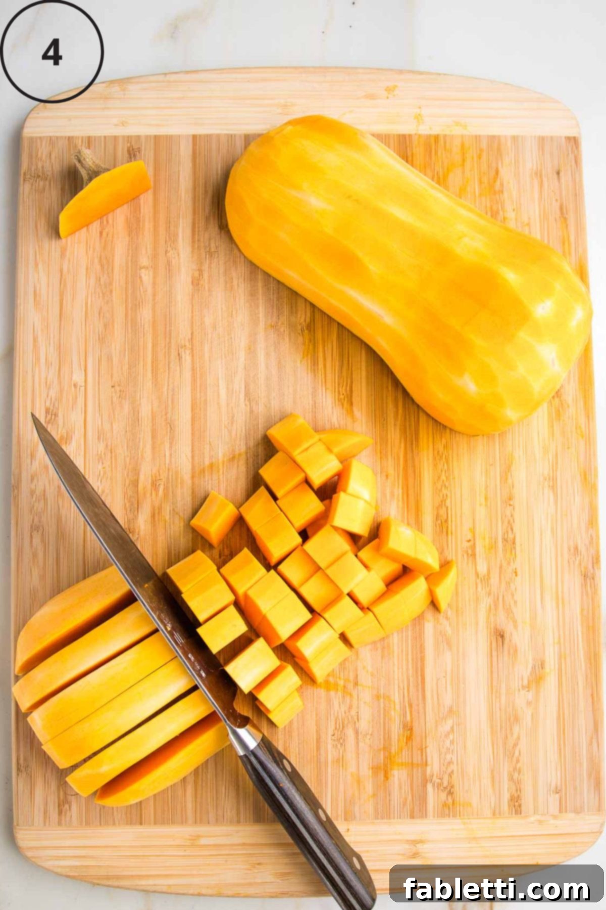 Velvety Vegan Butternut Bliss 9 Peeled and halved butternut squash. Long ½" strips are cut and then cut the other way for cubes.