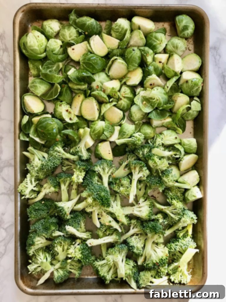 Pillowy Vegan Pizza Muffins with Ricotta Swirl 8 A baking tray filled with fresh broccoli florets and Brussels sprouts, seasoned and ready for roasting as pizza toppings.