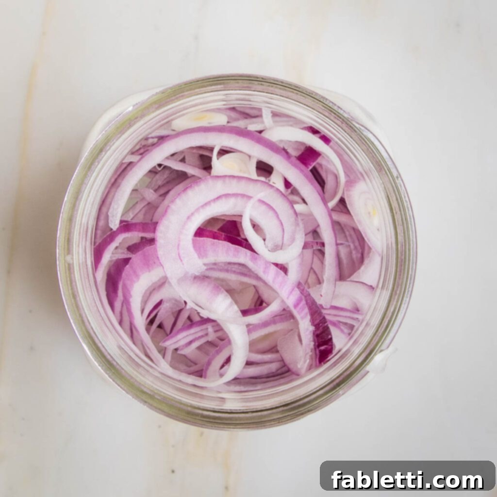 Deliciously Healthy Baked Falafel 15 Pickling liquid ingredients simmering in a saucepan.